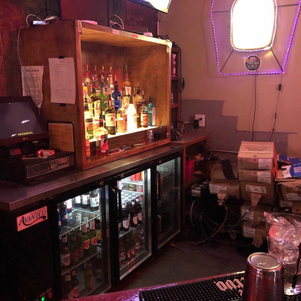 a bar with a lot of liquor a bar with a lot of liquor