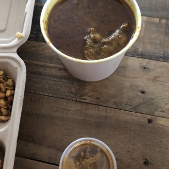 Zomsa - Khasi Ko Masu (Goat Curry), Nepali bento box on the left and momo cumin sauce on the bottom - Himalayan/Nepalese Near Me - El Cerrito, California Zomsa - Khasi Ko Masu (Goat Curry), Nepali bento box on the left and momo cumin sauce on the bottom - Himalayan/Nepalese Near Me - El Cerrito, California