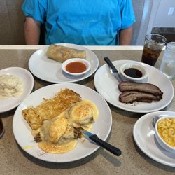 Rusty's Restaurant - Southern pulled pork eggs Benedict, Chorizo burrito, Biscuits and Gravy Side, Smoked Beef Brisket & Mac & cheese.