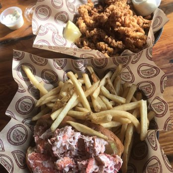 The Lobster Trap - Lobster Roll and small side of fried clam strips....very generous portion for a side! - Seafood Near Me - Bourne, Massachusetts The Lobster Trap - Lobster Roll and small side of fried clam strips....very generous portion for a side! - Seafood Near Me - Bourne, Massachusetts