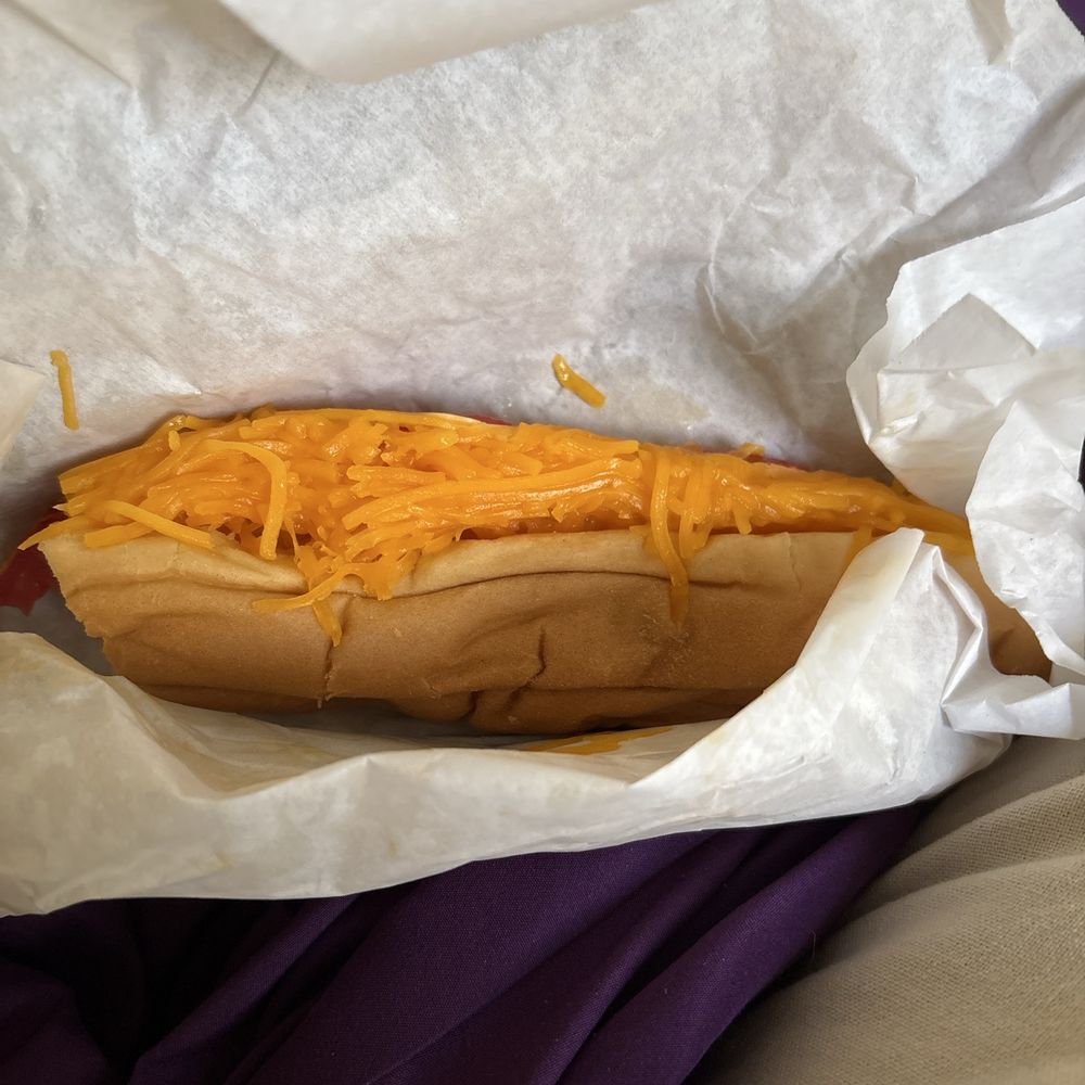 Hot dog with cheese, tomatoes and mayo.