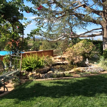 DC Gardening Service - a garden with a pond and a bench - Landscaping Near Me - North Hills, California DC Gardening Service - a garden with a pond and a bench - Landscaping Near Me - North Hills, California