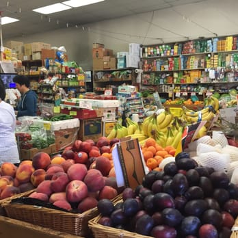 BK Market - a woman shopping in a grocery store - Fruits & Veggies Near Me - Vancouver, British Columbia