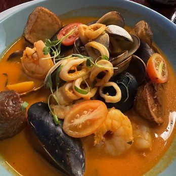 Señor Carbón - Peruvian Cuisine - Mariscos al curry, a beautifully spicy seafood smorgasboard with shrimp, mussels, clams, and calamari. - Peruvian Near Me - Seattle, Washington Señor Carbón - Peruvian Cuisine - Mariscos al curry, a beautifully spicy seafood smorgasboard with shrimp, mussels, clams, and calamari. - Peruvian Near Me - Seattle, Washington