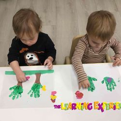 The Learning Experience - Lake Worth - Toddler Classroom talking about nature today, they created hand print trees
