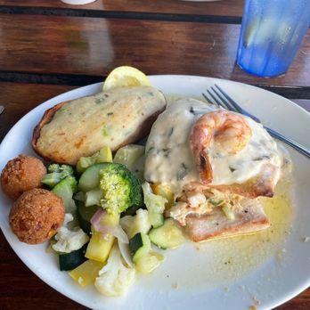 Pompano Joe's - Mahi Mahi "Bajan" , Twice - baked Potato , vegetable medley, hush puppies - Seafood Near Me - Destin, Florida Pompano Joe's - Mahi Mahi "Bajan" , Twice - baked Potato , vegetable medley, hush puppies - Seafood Near Me - Destin, Florida