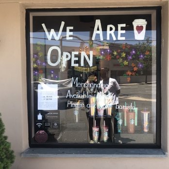 Starbucks - two people standing in front of a coffee shop - Coffee & Tea Near Me - Manhasset, New York