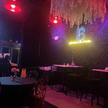 Berny’s Kitchen & Bar - a restaurant with tables and chairs - Haitian Near Me - Pembroke Park, Florida