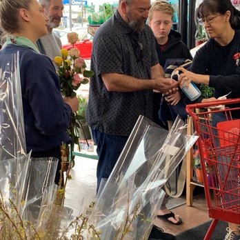 Trader Joe's - Employees passing out flowers and pumping hand sanitizer. - Grocery Near Me - Huntington Beach, California Trader Joe's - Employees passing out flowers and pumping hand sanitizer. - Grocery Near Me - Huntington Beach, California