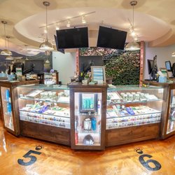 Lightshade Rec Dispensary - Retail Display at Lightshade Iliff - Another view of the dispensary's product showcase, featuring cannabis flower jars, edibl...