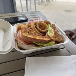 Oceanside Bar and Grill - Club sandwich with onion rings