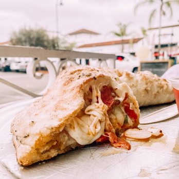 Graziano's Pizzaria - a half eaten pizza - Pizza Near Me - Oceanside, California Graziano's Pizzaria - a half eaten pizza - Pizza Near Me - Oceanside, California