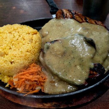Toppings Too Restaurant - Bbq pork chop with java rice on a sizzling plate. - Filipino Near Me - Union City, California Toppings Too Restaurant - Bbq pork chop with java rice on a sizzling plate. - Filipino Near Me - Union City, California
