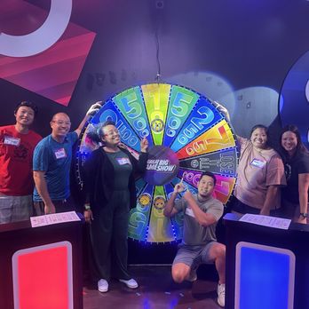Great Big Game Show Minneapolis - Group photo by the giant wheel! - Escape Games Near Me - Bloomington, Minnesota Great Big Game Show Minneapolis - Group photo by the giant wheel! - Escape Games Near Me - Bloomington, Minnesota