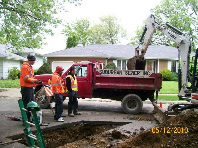 Slide of Suburban Sewer & Septic
