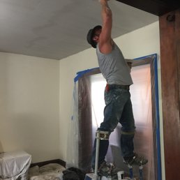 tony working really hard on stilts plastering our living room tony working really hard on stilts plastering our living room