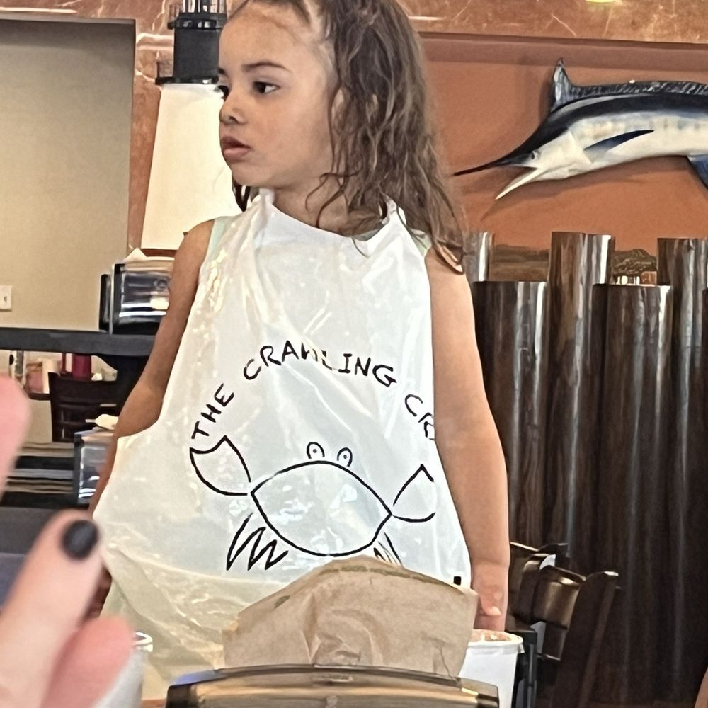 The Crawling Crab - Baby in her bib! - Seafood Near Me - Lakewood, Colorado The Crawling Crab - Baby in her bib! - Seafood Near Me - Lakewood, Colorado