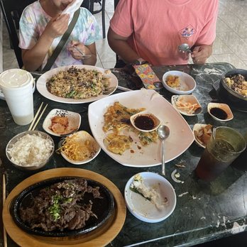 Bulgogi Korean Bistro - Upper left: kids bulgogi. Upper right: stone pot w/ bulgogi. Front left: bulgogi entrée. Middle: seafood pancake. - Korean Near Me - Edmond, Oklahoma Bulgogi Korean Bistro - Upper left: kids bulgogi. Upper right: stone pot w/ bulgogi. Front left: bulgogi entrée. Middle: seafood pancake. - Korean Near Me - Edmond, Oklahoma