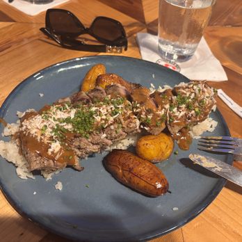 Red Rooster Overtown - Jerk NY Strip Steak with coconut rice and plantain 1/5 - Cocktail Bars Near Me - Miami, Florida