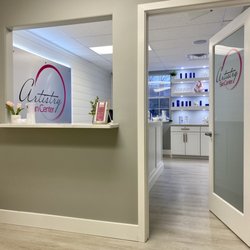 Artistry Skin Center - Check in window