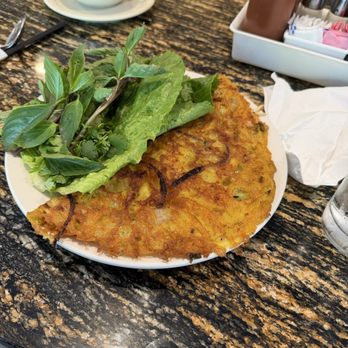 Grand Bistro - Banh Xeo crispy, tasty with pork belly and shrimp inside one of the best to serve this dish in Missouri - Asian Fusion Near Me - St. Louis, Missouri Grand Bistro - Banh Xeo crispy, tasty with pork belly and shrimp inside one of the best to serve this dish in Missouri - Asian Fusion Near Me - St. Louis, Missouri