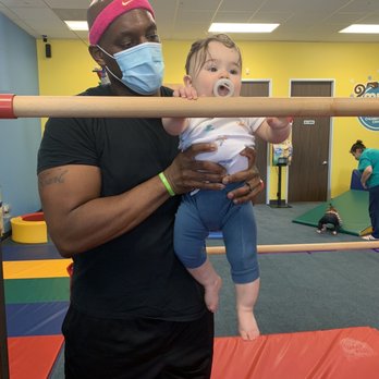 My Gym - Mr. Karl helping Alexander on the bars. - Gyms Near Me - The Woodlands, Texas My Gym - Mr. Karl helping Alexander on the bars. - Gyms Near Me - The Woodlands, Texas
