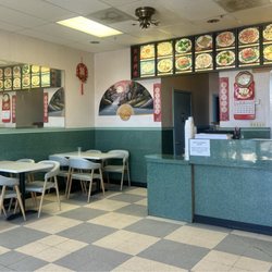 Happy China - Has a small dining area of four tables.