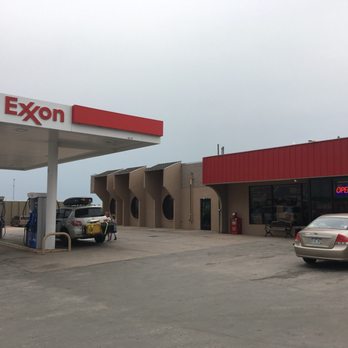 Exxon - a gas station with cars parked in front of it - Gas Stations Near Me - Pine Bluffs, Wyoming