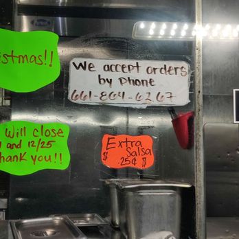 Tacos El Chikilin - a taco stand with signs on it - Food Trucks Near Me Tacos El Chikilin - a taco stand with signs on it - Food Trucks Near Me