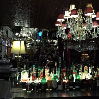 La Maison Du Jazz - a chandelier and bottles of liquor - Jazz & Blues Near Me - Laval, Quebec