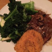 Photo of Village Natural - New York, NY, United States. Seitan dish with steamed veggies and smashed sweet potato
