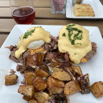 Hobnob - Fried Green Tomato Brisket Benedict with Brunch Potatoes and Pomegranate Mimosa - Sandwiches Near Me - Richmond, Virginia Hobnob - Fried Green Tomato Brisket Benedict with Brunch Potatoes and Pomegranate Mimosa - Sandwiches Near Me - Richmond, Virginia