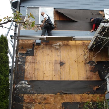 Superior Exterior Systems - two men working on a house - General Contractors Near Me Superior Exterior Systems - two men working on a house - General Contractors Near Me