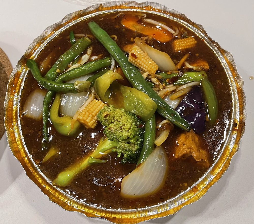 Manchu & Masala Logo