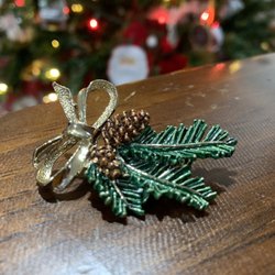 Attic Antiques N Things - Christmas Pin with garland, pinecones and a golden bow.
