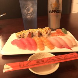 Sushi Deluxe and a tall Sapporo Sushi Deluxe and a tall Sapporo