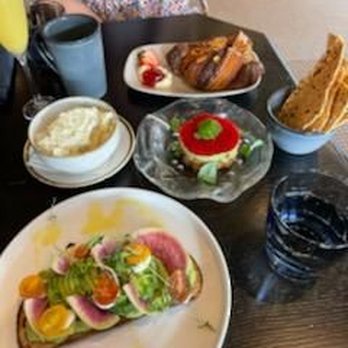 Marsh House - Avocado toast, salmon tartare, almond croissant, grits. All great, wonderful service. Mimosa was strong, so perfect as well. - Southern Near Me - Nashville, Tennessee