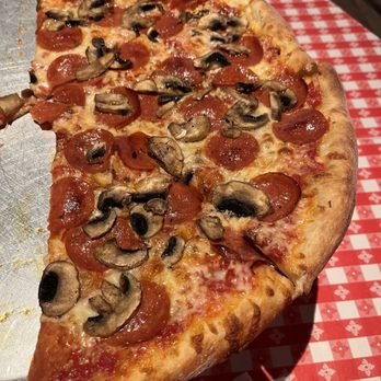 Home Slice Pizza - Half of a large Pepperoni and mushroom pizza. - Pizza Near Me - Austin, Texas Home Slice Pizza - Half of a large Pepperoni and mushroom pizza. - Pizza Near Me - Austin, Texas