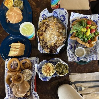 Central BBQ - : Pulled Chicken Sandwich (Large) + Onion Rings : BBQ Chicken Nachos  : House Salad  : Caramel Cake  : Potato Salad + Green Beans - Barbeque Near Me - Memphis, Tennessee