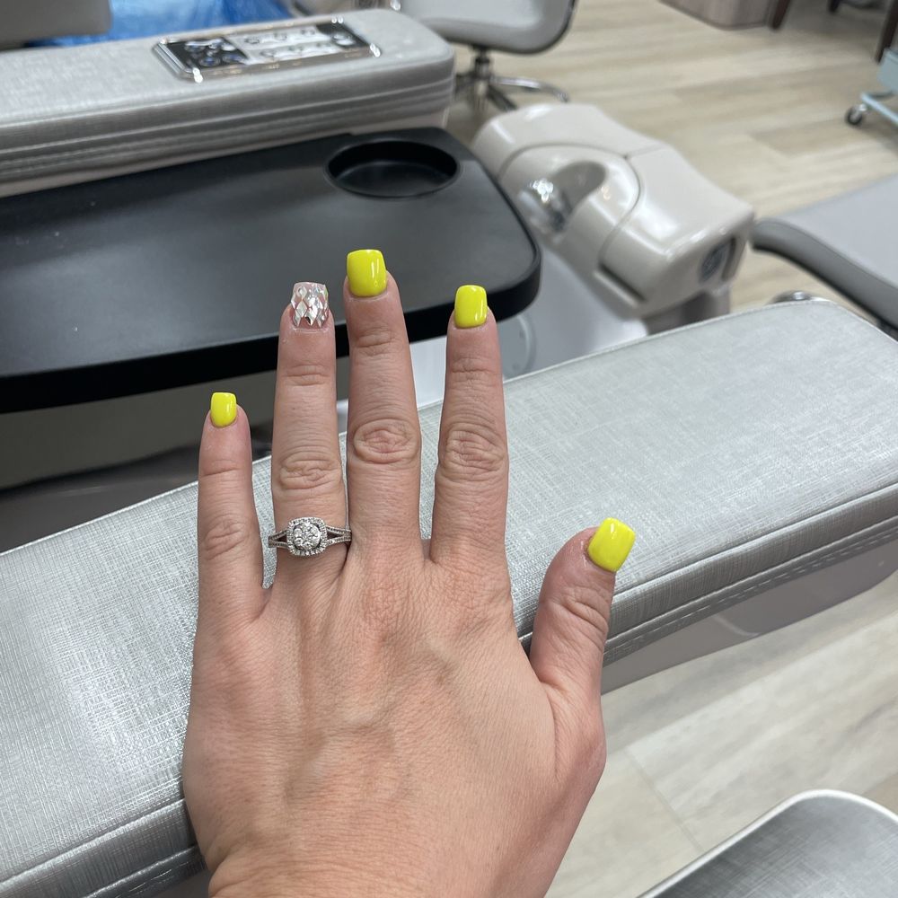 Capri Nails - Acrylic fill bright yellow with a shiney gem ring finger. - Nail Salons Near Me - Phoenix, Arizona