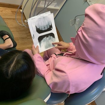 Elena C Encinas, DDS - Showing Lila where her permanent teeth are hiding - General Dentistry Near Me - Cerritos, California