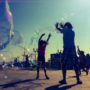 Seal Beach Pier - Kids catching bubbles at the pier. - Local Flavor Near Me - Seal Beach, California