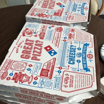 Domino's Pizza - a stack of pizza boxes on a table - Pizza Near Me - Columbia, South Carolina
