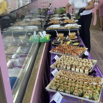 Starfish Coastal Catering - 3 treys of assorted Sushi rolls, chicken satay, pork belly buns, mini sliders and pot stickers - Caterers Near Me - Newport Beach, California