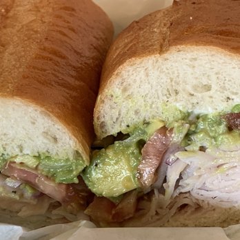 Board & Brew - Oceanside - TURKADO (turkey breast with jack cheese, mayo, avocado, red onion, lettuce, and sliced tomato) plus bacon on a toasted baguette (to-go) - Sandwiches Near Me - Oceanside, California