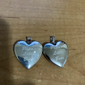 PicturesOnGold - Side-by-side of the 1st and 2nd 1.25-inch heart lockets showing that the 1st has a garnet on its bail whereas its replacement does not. - Jewelry Near Me - Linden, New York PicturesOnGold - Side-by-side of the 1st and 2nd 1.25-inch heart lockets showing that the 1st has a garnet on its bail whereas its replacement does not. - Jewelry Near Me - Linden, New York