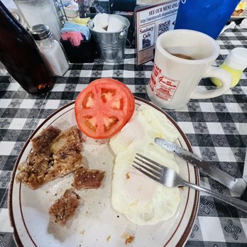 Sanitary Cafe - Fries tenderloin and eggs with side of tomato - American Near Me - Reidsville, North Carolina Sanitary Cafe - Fries tenderloin and eggs with side of tomato - American Near Me - Reidsville, North Carolina