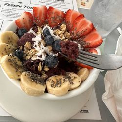 Stella's Cafe - Açaí bowl. Size of a cup of soup for $17. The açaí is crushed ice texture.