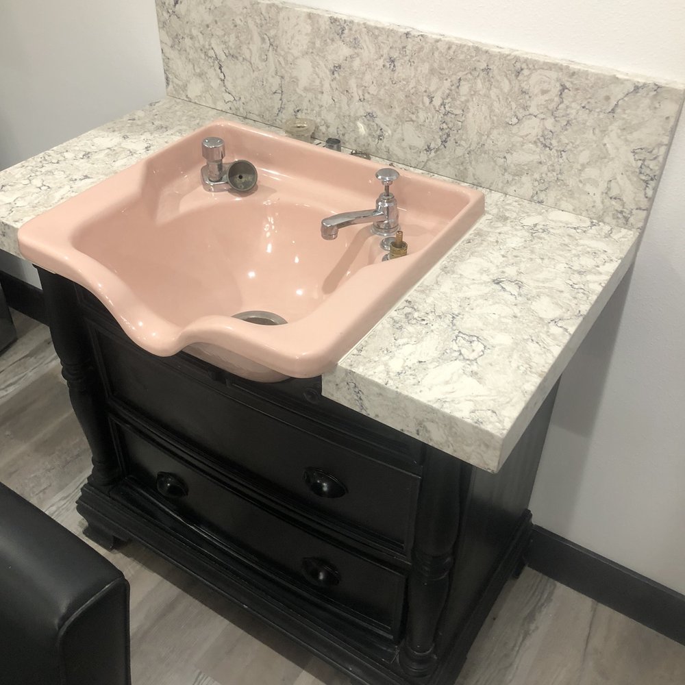 Custom Concepts Remodeling - a pink sink in a bathroom - General Contractors Near Me Custom Concepts Remodeling - a pink sink in a bathroom - General Contractors Near Me
