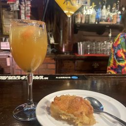 a plate of food and a glass of orange juice a plate of food and a glass of orange juice
